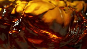 Super Slow Motion Detail Shot of Waving Golden Liquid at 1000fps. - Powered by Shutterstock - Get 15% off with code: PIKWIZARD15
