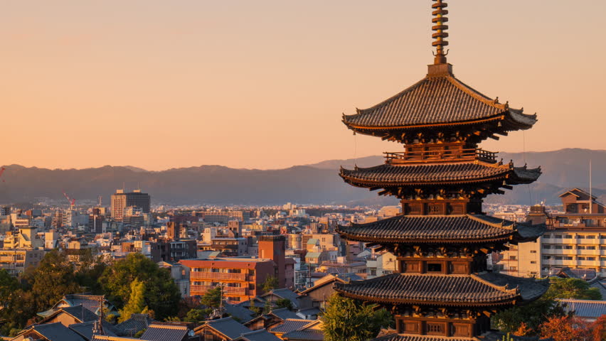 kyoto city skyline timelapse from day to night traditional temple pagoda hokan ji or yasaka tower, Higashiyama-ku district in the background