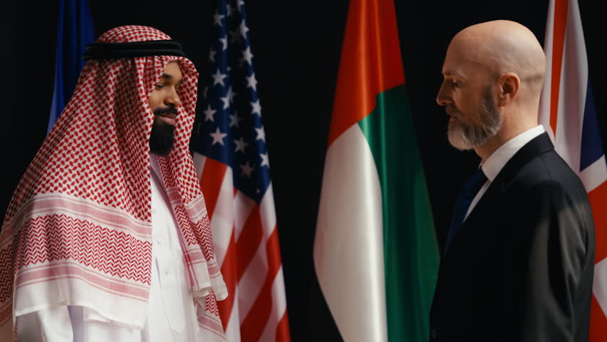 UAE sheikh shakes hands with a European official during an international summit