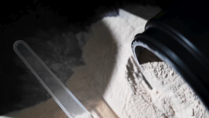 Amino acid food supplement, creatine powder in a measuring scoop, Sports nutrition 