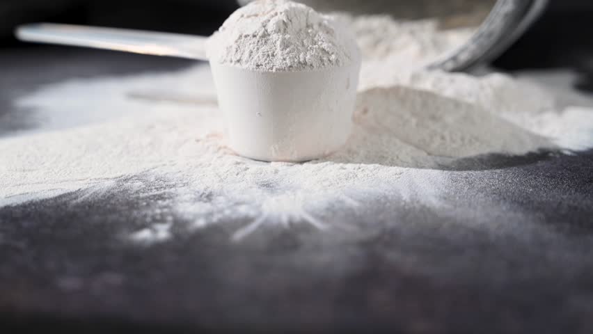 Amino acid food supplement, creatine powder in a measuring scoop, Sports nutrition 