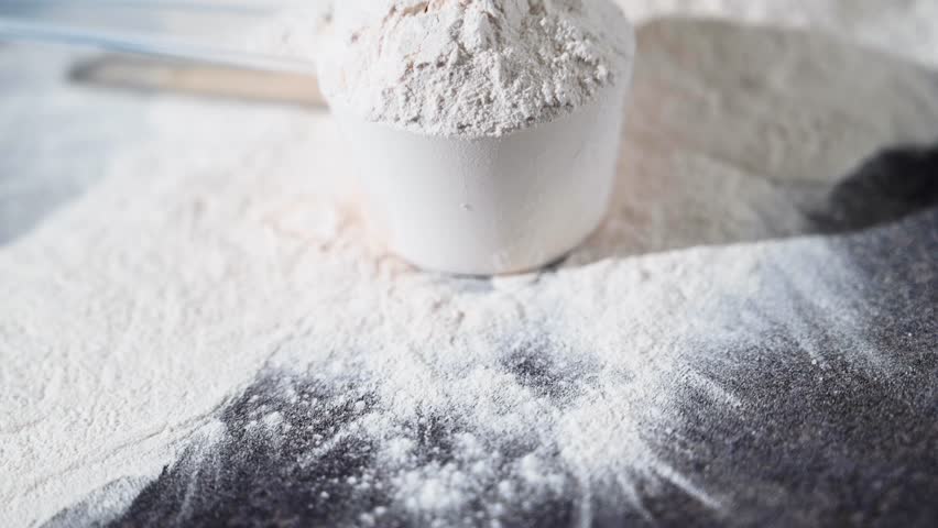 Amino acid food supplement, creatine powder in a measuring scoop, Sports nutrition 