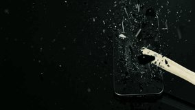 Super Slow Motion Shot of Hammer Breaking Mobile Phone Glass at 1000fps. - Powered by Shutterstock - Get 15% off with code: PIKWIZARD15