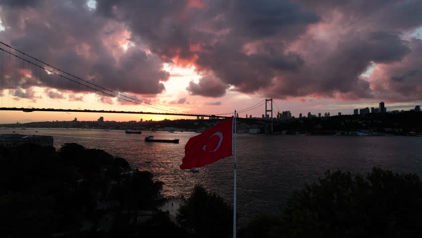 Turkish Flag in the 15th July Martyrs Bridge Sunset Drone Video, Beylerbeyi Beach, Uskudar Istanbul, Turkiye (Turkey)