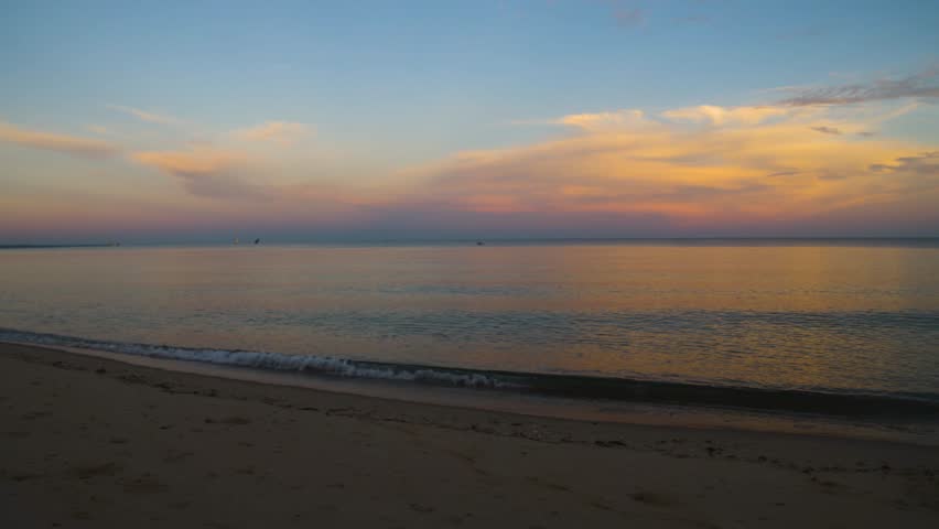 4K footage showcasing a stunning sunset over the Indian Ocean, Mozambique Channel, with vibrant orange skies and peaceful waters off the coast of Madagascar.
