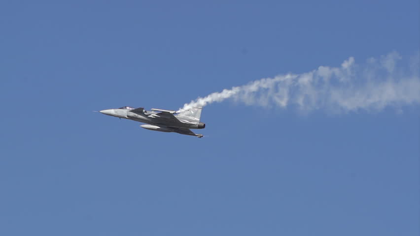 Fighter planes perform stunts in the sky.