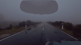 Car moving road in rainy day with fog in dusk with bad weather conditions, Madeira island - Powered by Shutterstock - Get 15% off with code: PIKWIZARD15