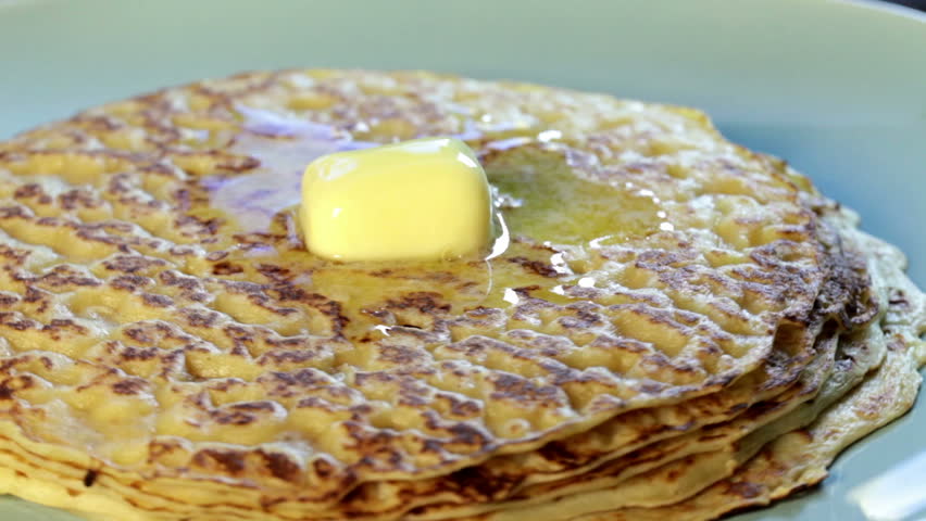 Appetizing fried pancake rotates in the frame in focus close-up