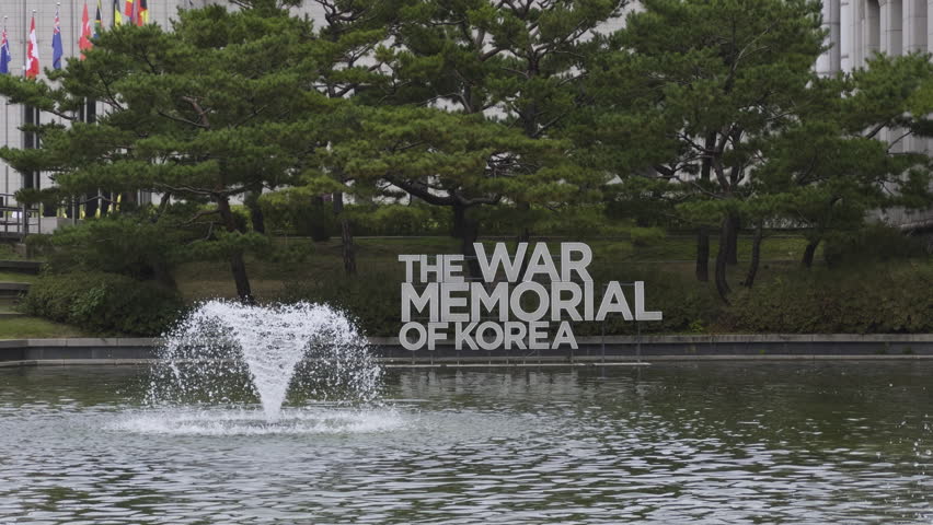 War Memorial of Korea entrance sign with water fountain on overcast day