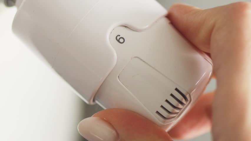 Regulation control of the heating temperature on the battery in the room. Adjusting turn on heating up,  thermostatic radiator valve on radiator.