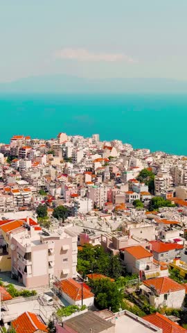 Vertical video. Kavala, Greece. Historic city center. Summer, tourist season, Aerial View. Rich colors