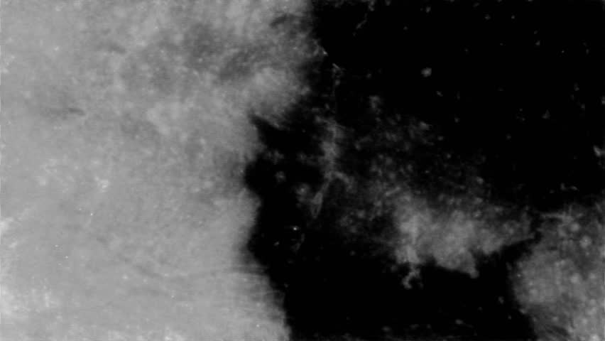 Rapidly Flashing Image Like From A Broken Old CRT TV. Black Grunge Abstract Background Loop. Irregular Abstract Image of Moon Surface, Flashing Fast.