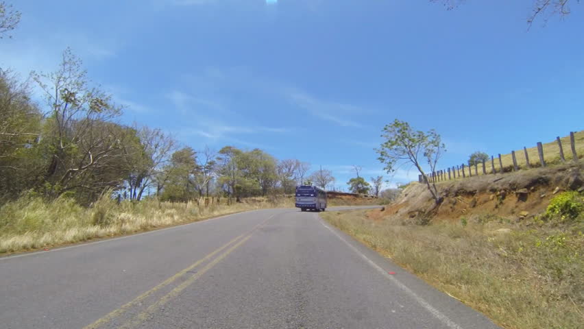 Vehicle shot of driving through central Costa Rica along highway 142 in March,