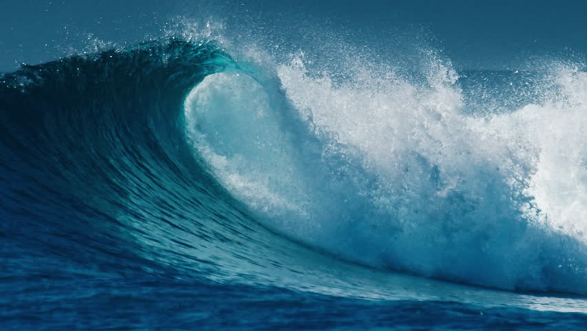 Ocean wave rolls and breaks in the Maldives