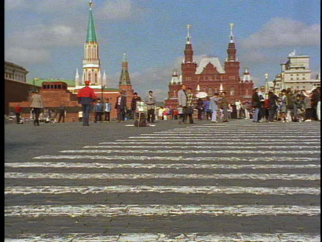 Moscow, Russia, Red Square, crowds, red brick in foreground, medium wide shot