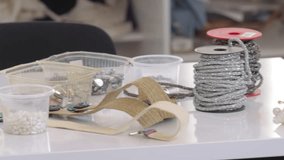 Explore a fashion designer’s workspace with sewing tools, beads, ribbon, and fabrics. Perfect for projects on tailoring, fashion design, crafting, and the art of handmade clothing and garment creation - Powered by Shutterstock - Get 15% off with code: PIKWIZARD15