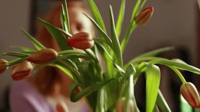 Skilled florist selecting vibrant red tulips, arranging delicate arrangement with meticulous precision inside bright, welcoming flower shop - Powered by Shutterstock - Get 15% off with code: PIKWIZARD15