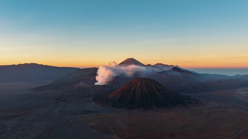 Hyperlapse aerial view flying orbit around mount Bromo active volcano at sunrise, Java, Indonesia 