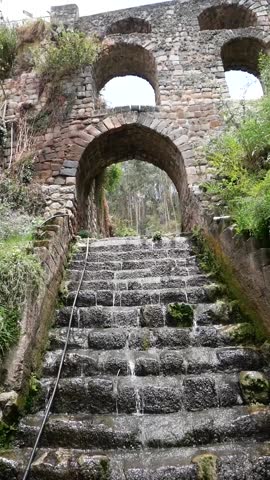 Colonial Aqueduct of Sapantiana, Colonial Architecture where a Stream Flows Under an Arch and Down the Steps in Cusco, Peru