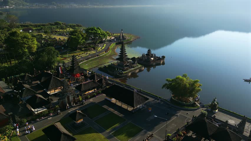 Traditional Balinese Water Temple in Bali in the middle of a lake and mountains. Ulun Danu Beratan