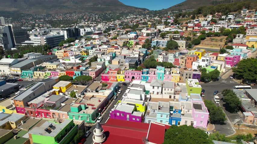 Cape Town’s colorful buildings line the streets, adding vibrancy to the city’s lively atmosphere.