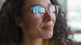 Close up face Arabian Indian Hispanic Latina woman female girl student study learning thinking solution glasses health vision sight contemplate ponder high school reflect university library education - Powered by Shutterstock - Get 15% off with code: PIKWIZARD15