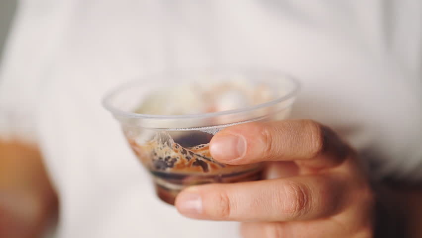 Close up of a beautiful woman woman eating chocolate pudding.. High quality FullHD footage
