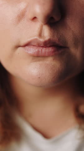 close-up of a young woman eating in a modern kitchen, enjoying a healthy breakfast 