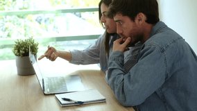 Young couple managing their household finances by reviewing monthly expenses, calculating mortgage, utility bills, and food costs, and using a laptop to track their spending and savings in a challengi - Powered by Shutterstock - Get 15% off with code: PIKWIZARD15