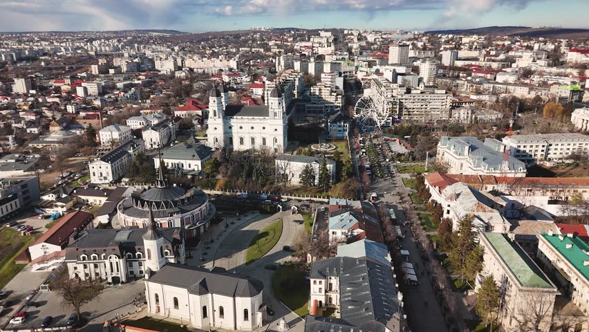 Drone video of Iasi city center showing cathedrals, Ferris wheel, and Ștefan cel Mare Boulevard