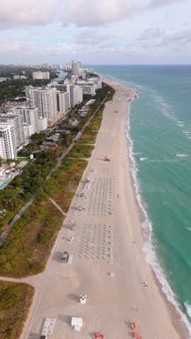 Aerial shot of Miami Beach, showcasing its skyline, sandy beaches, and turquoise waters under a sunny sky, highlighting it as a perfect destination for relaxation, South Beach, Miami, Florida