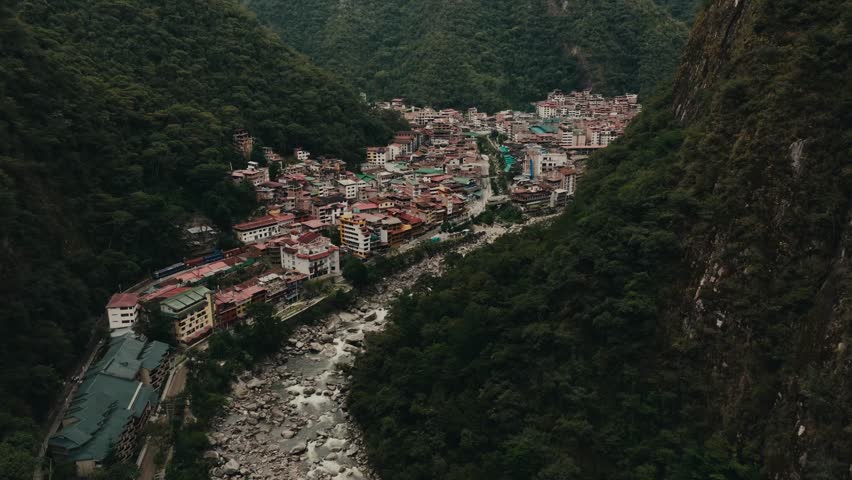 Machupicchu Pueblo Village By Urubamba River In Peru. - aerial shot