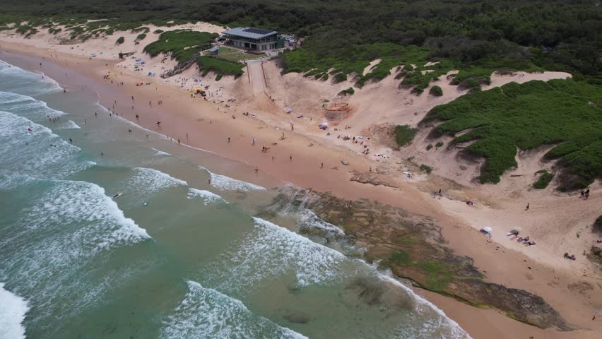 Tourists At Soldiers Beach During Summer In Norah Head, NSW, Australia - Drone Shot