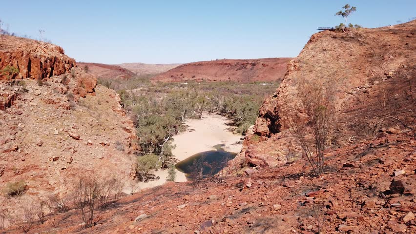 Viewing platform overlooking Ormiston Gorge in dry season. Northern Territory, Outback Red Center. Lookout platform aerial view along Ghost Gum walk in West MacDonnell Ranges, Central Australia.