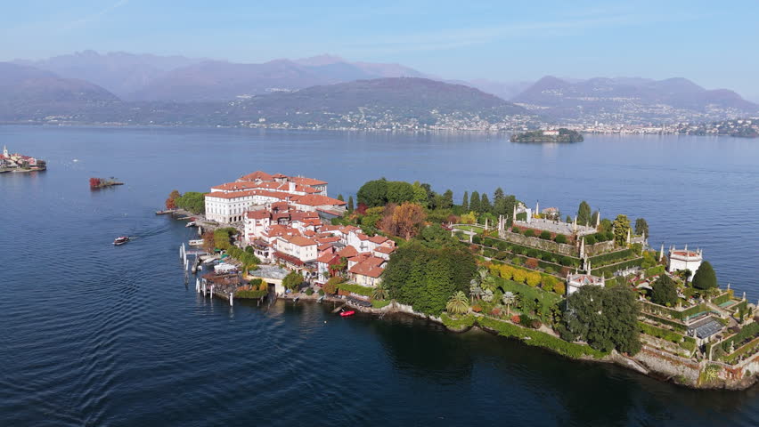 Serene aerial view of Isola Bella on Lake Maggiore, Italy, with boats cruising