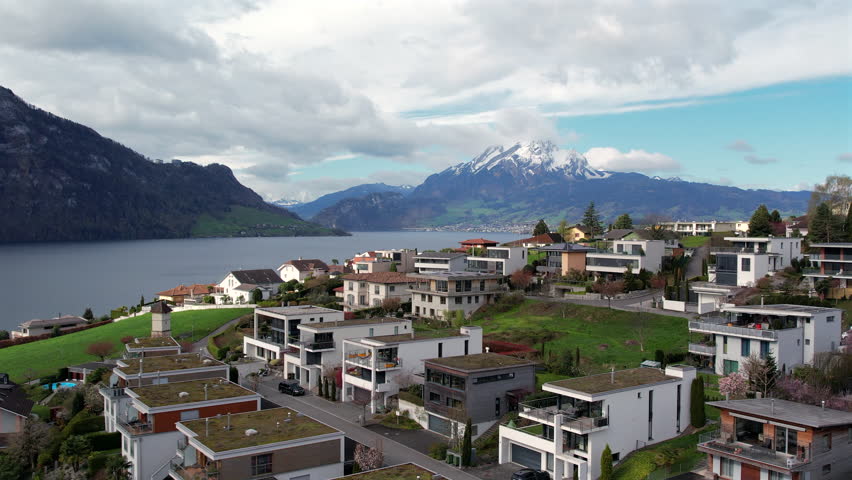 Discover the breathtaking beauty of Lake Lucerne in Switzerland, a picturesque destination perfect for luxury travel and adventure, surrounded by stunning mountains and charming villages