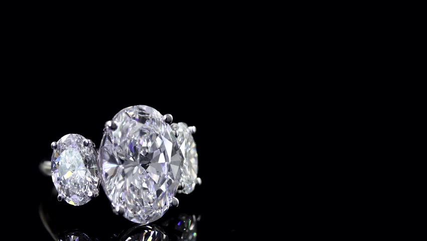 beautiful bright and shine diamond ring on the mirror and black background