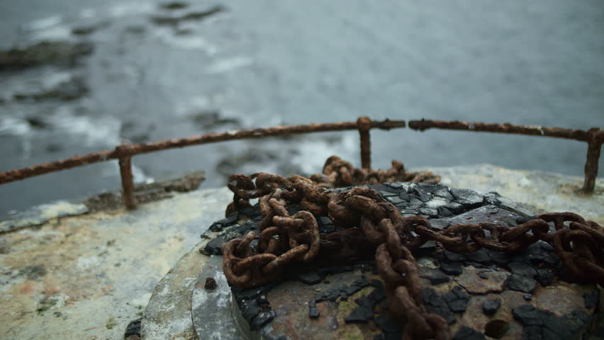 Rusted chains on lighthouse rooftop