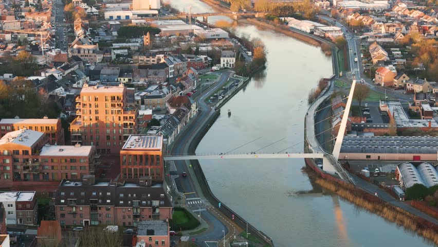 wetteren belgium city hall bridge over river their warm glow sunrise circling aerial shot scenic overview beauty community exploration videography visuals light atmosphere harmony