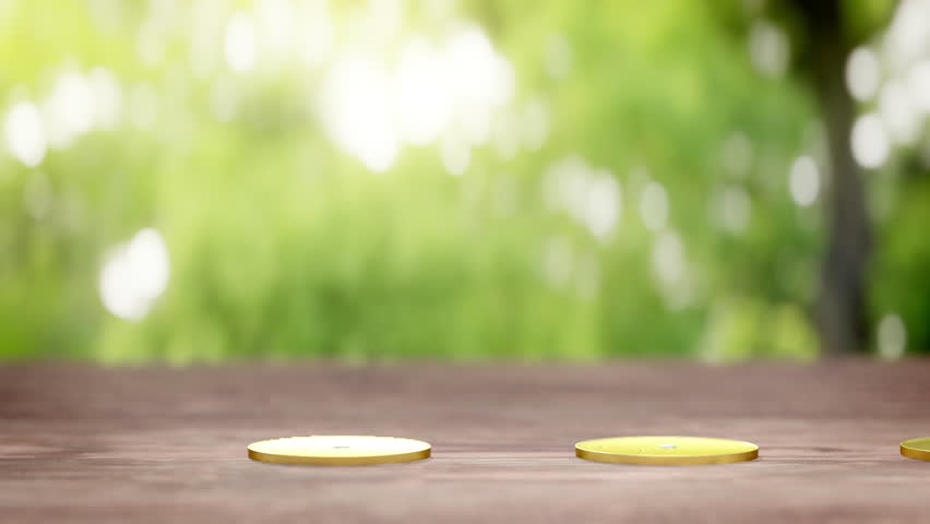 Green plants sprouting from increasing stacks of gold coins on a wooden surface with a blurred natural background, symbolizing financial growth.