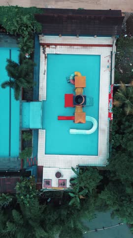 Aerial View of a Colorful Water Playground in a Swimming Pool
