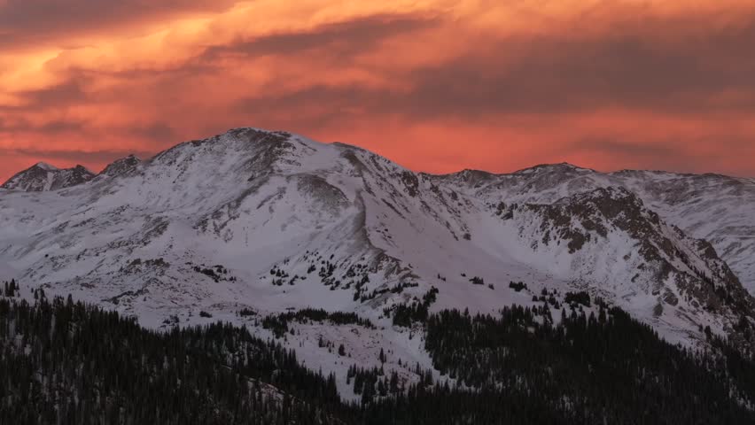 Last light winter solstice December Rocky Mountains golden hour aerial drone Colorado Continental Divide Loveland Pass Herman Gulch Coon Hill vibrant sunset dusk rugged snowy peaks parallax circle