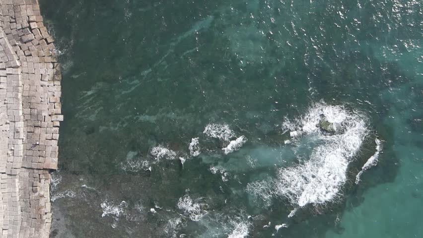 Aerial drone footage of the Mediterranean Corniche in Alexandria, Egypt.