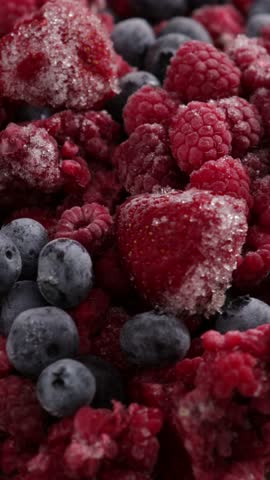 close up of frozen summer berry strawberry food rotation