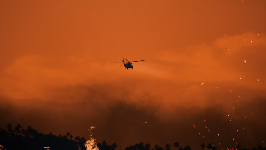 Wildfire response efforts in Los Angeles 2025 as flames engulf the landscape and helicopters battle the blaze