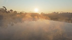 Colored autumn pond in the morning mist. Misty early winter morning at lake where water evaporates creating dangerous fog - Powered by Shutterstock - Get 15% off with code: PIKWIZARD15