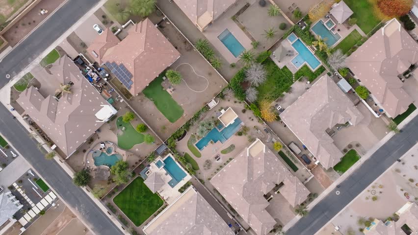 American neighborhood with villas and private swimming pool in Arizona,USA. Sunny day in summer season. Luxury housing area near Phoenix City. Aerial top down shot.
