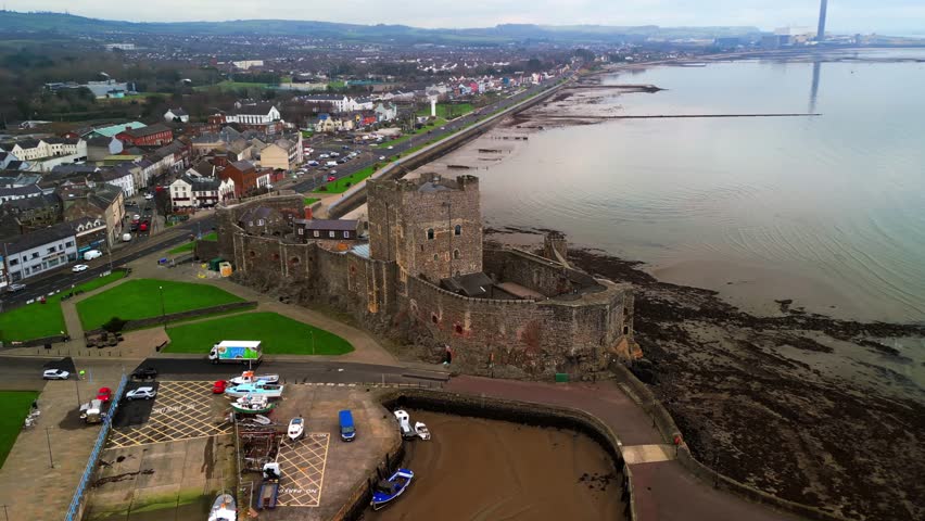 Advancing, rotating aerial shot of Carrickfergus Castle in Carrickfergus, Northern Ireland. Produced in 4K, 30FPS and in Rec709 colour.