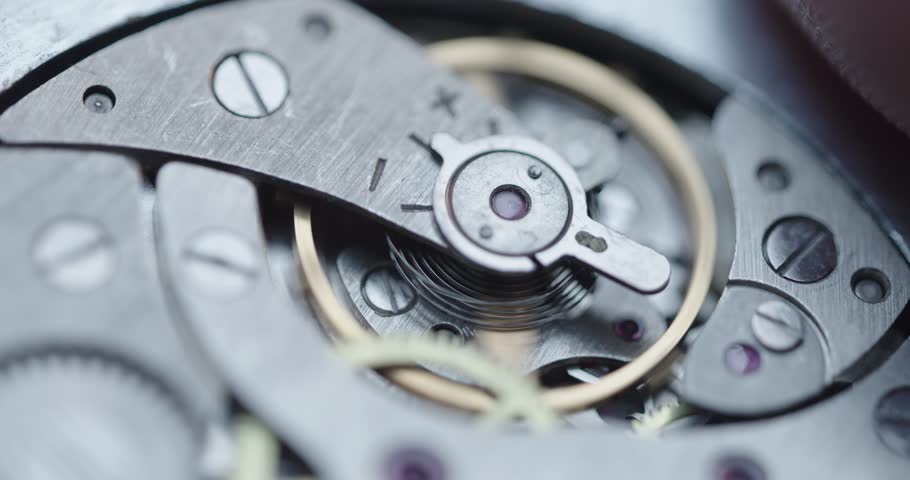 Intricate and elaborate details of mechanical watch finely crafted gears and essential components. Soft focus