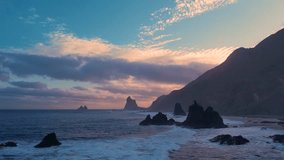 Ocean waves crash on rocks and spray in beautiful sunset light near Playa de Benijo beach in Tenerife, Canary Islands - Powered by Shutterstock - Get 15% off with code: PIKWIZARD15